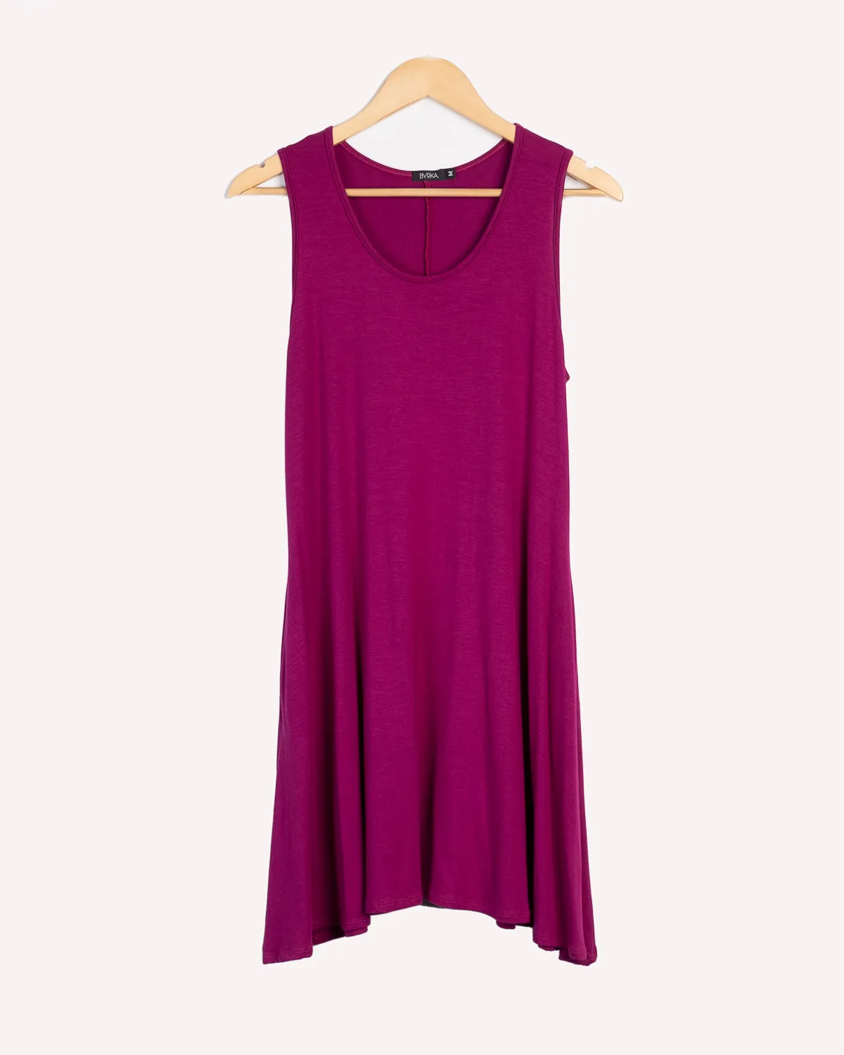Women's A-line dress 2" above the knee sleeveless and side pockets.